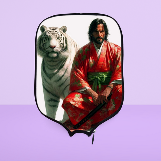 A pickleball paddle cover featuring an image of a person in a red kimono with a white tiger in the background.