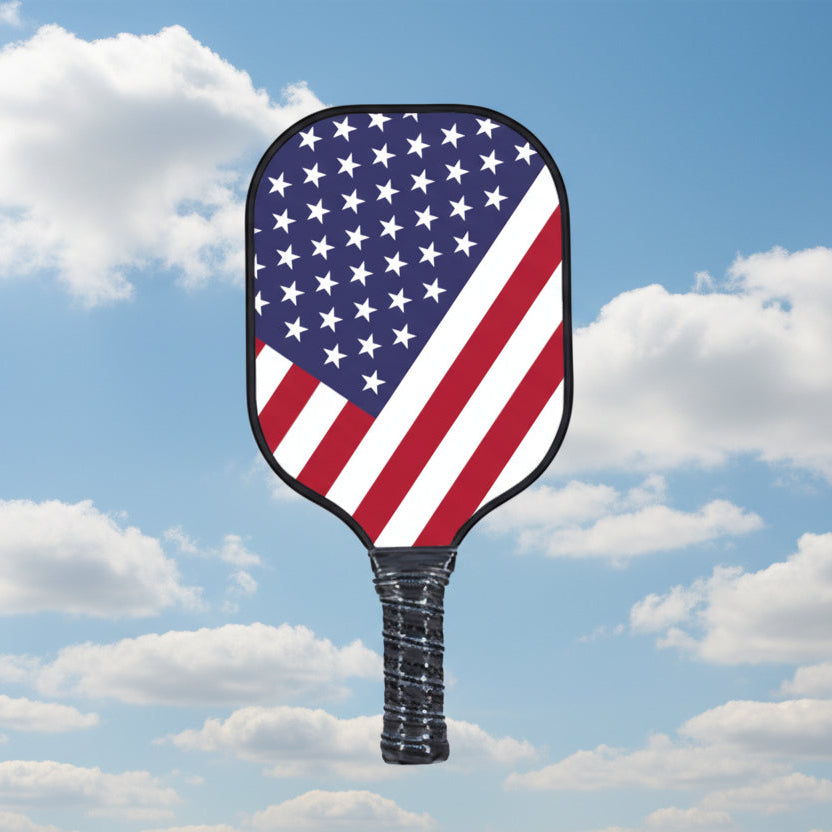 Pickleball paddle with the American flag design on the surface.