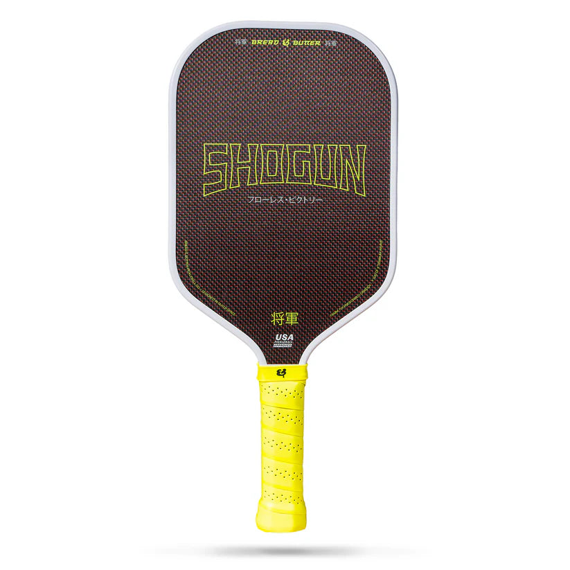 Shogun pickleball paddle with yellow handle on a white background