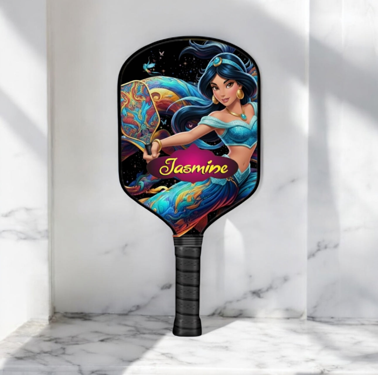 Pickleball paddle with Jasmine character design on a marble background