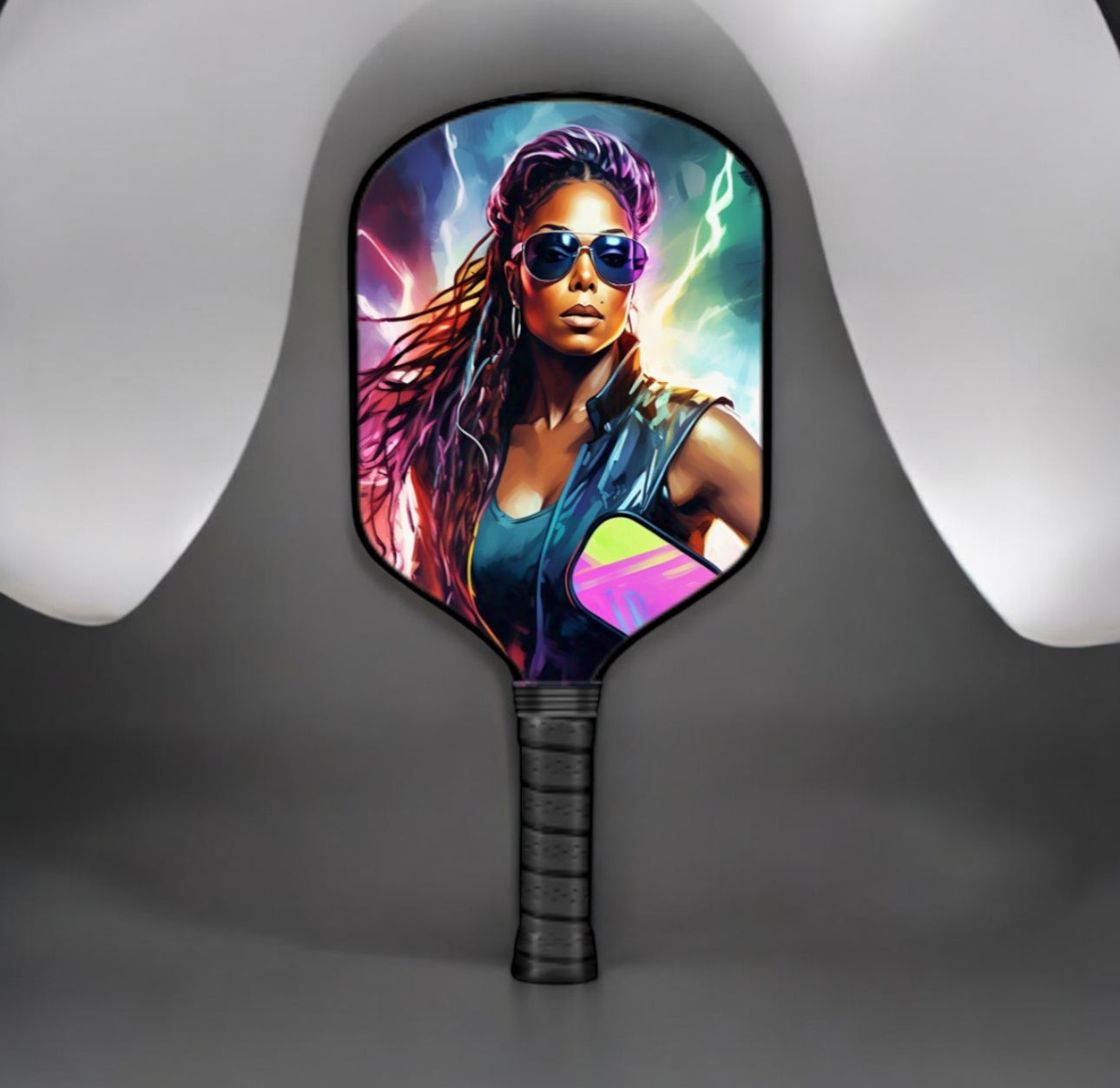Pickleball paddle with a colorful design of a woman on a gray background