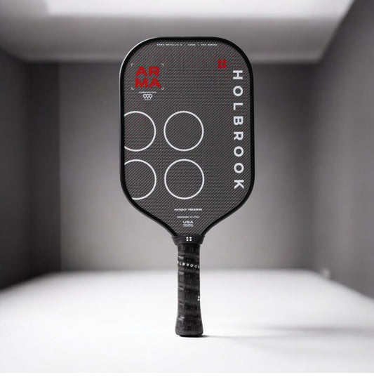 Black pickleball paddle with branding on a gray background