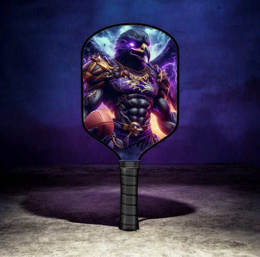 Pickleball paddle with an eagle warrior design on a dark background