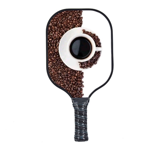 Coffe cup and beans on a pickleball paddle