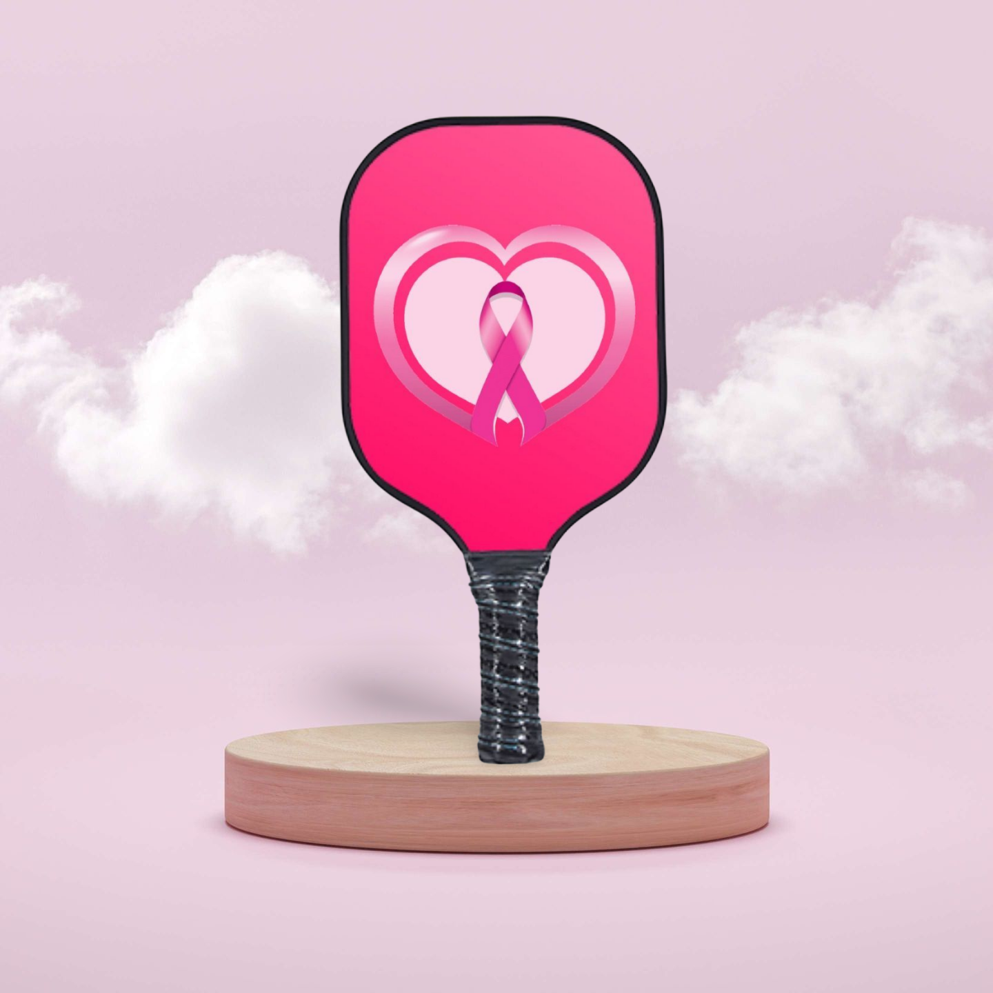 Pink pickleball paddle with a heart and ribbon design on a pink background for breat cancer  awareness