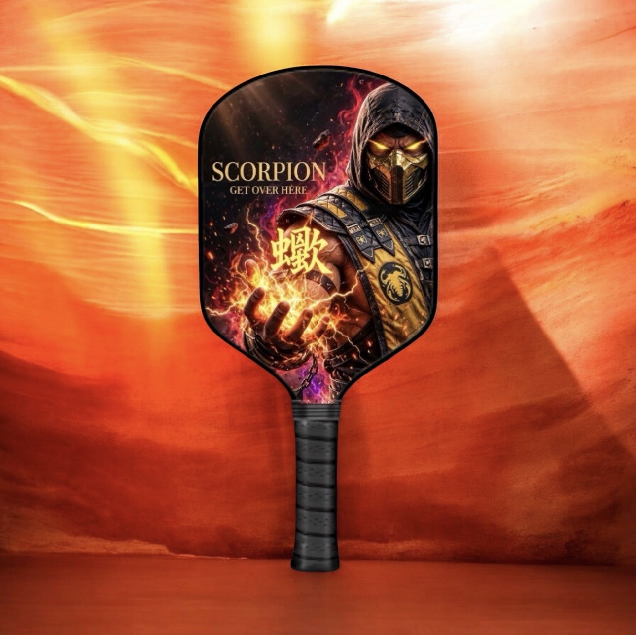 A pickleball paddle featuring a detailed graphic of the Scorpion character from Mortal Kombat, with the text 'SCORPION GET OVER HERE' and a Chinese character, set against a fiery orange and red background.