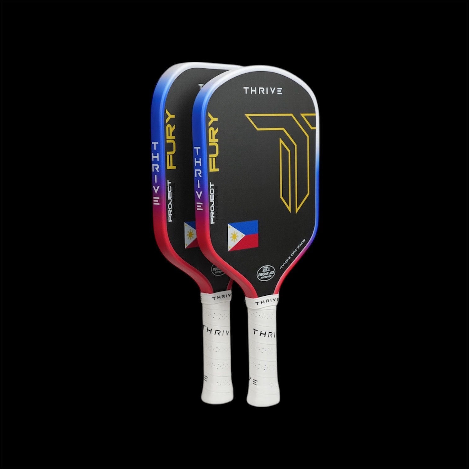 Two pickleball paddles with 'Fury' and 'Thrive' branding on a black background
