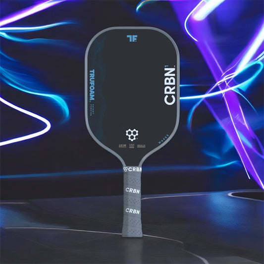 Pickleball paddle with CRBN branding on a dynamic blue and purple background