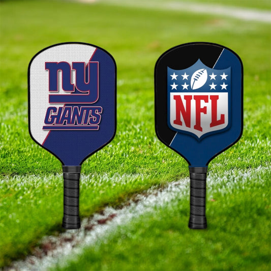 Two pickleball paddles with 'New York Giants' and 'NFL' logos on a grass background