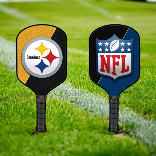 Two pickleball paddles with Steelers and NFL logos on a grass background