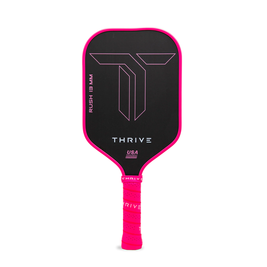Black and pink pickleball paddle with 'Thrive' branding on a white background