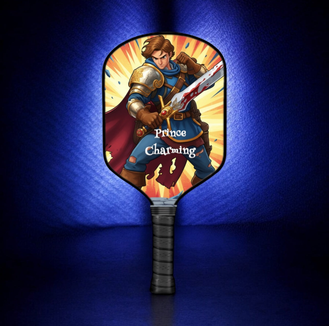 Pickleball paddle with 'Prince Charming' design on a blue background