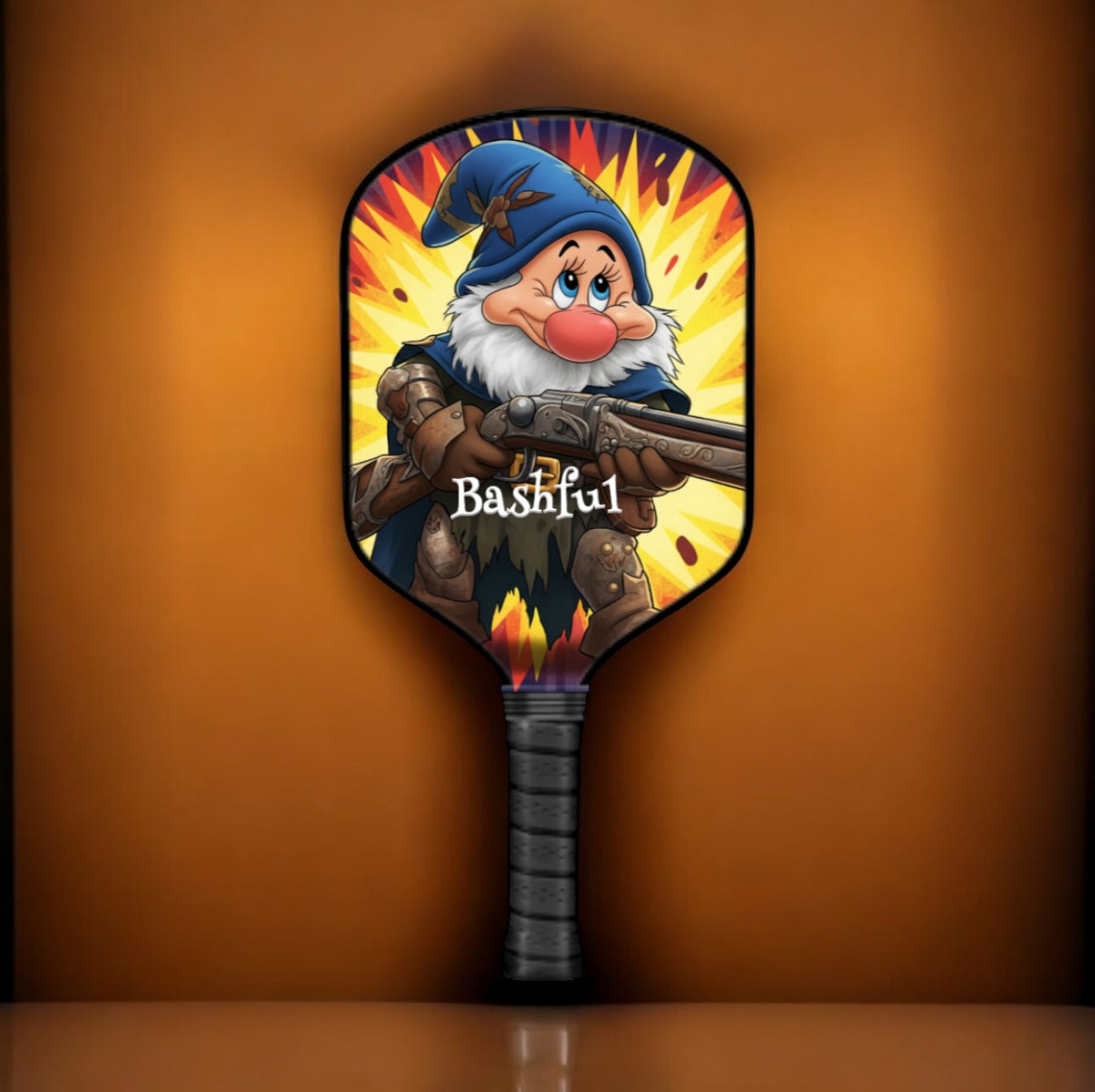 Pickleball paddle with a cartoon character design on an orange background