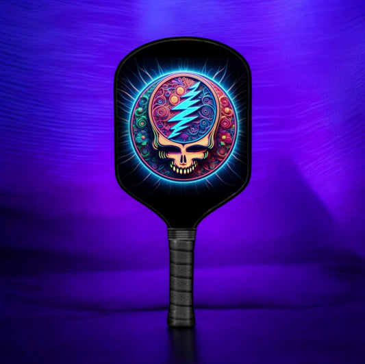 Pickleball paddle with colorful skull design on a purple background