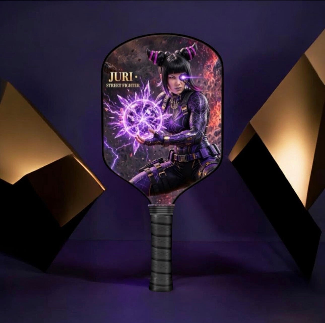 A paddle-shaped fan or light holder featuring a printed graphic of the character Juri from Street Fighter, shown against a dark purple background with geometric gold and black light fixtures.
