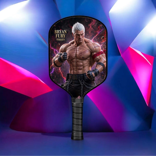 A handheld paddle-style fan or wind spinner featuring a printed graphic of the character Bryan Fury from Tekken on the head and a textured black handle, set against a colorful geometric blue, purple, and pink background.