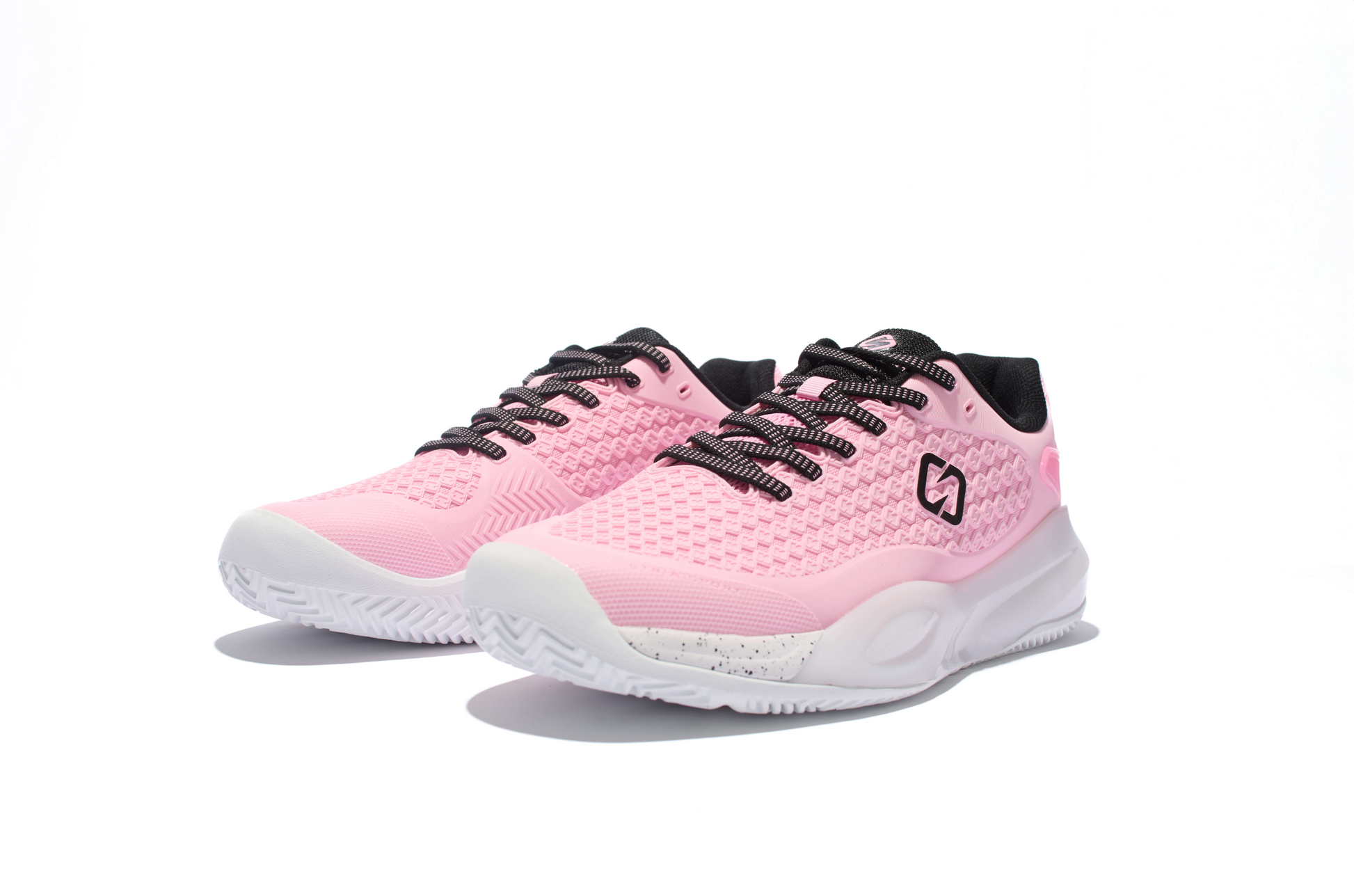 Pink running shoes with black accents on a white background
