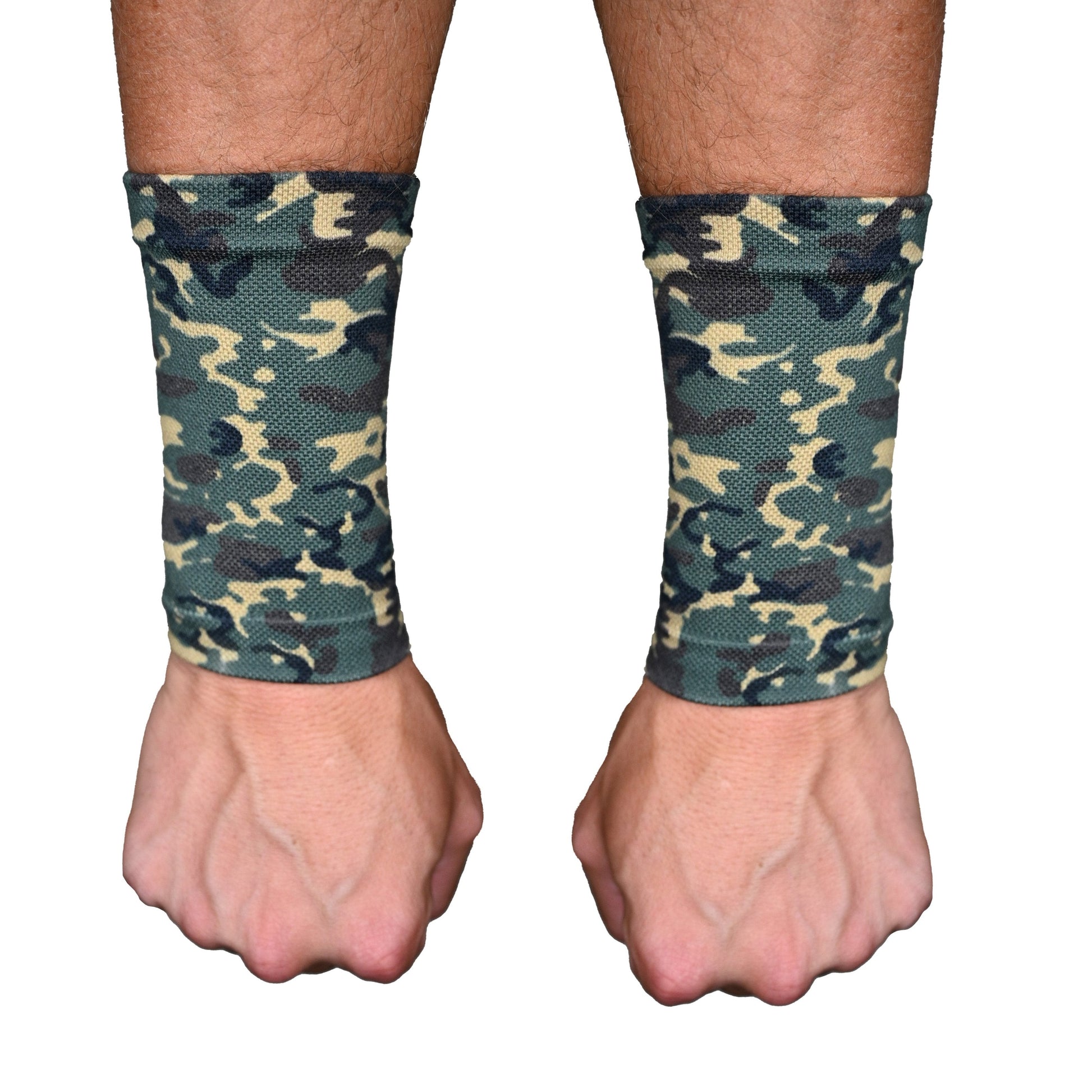 Camouflage wrist wraps on a person's wrists with a white background